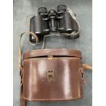 A PAIR OF DOLLOND LONDON BINOCULARS IN BROWN LEATHER CASE - MADE IN ENGLAND - LUMA 8 X 30