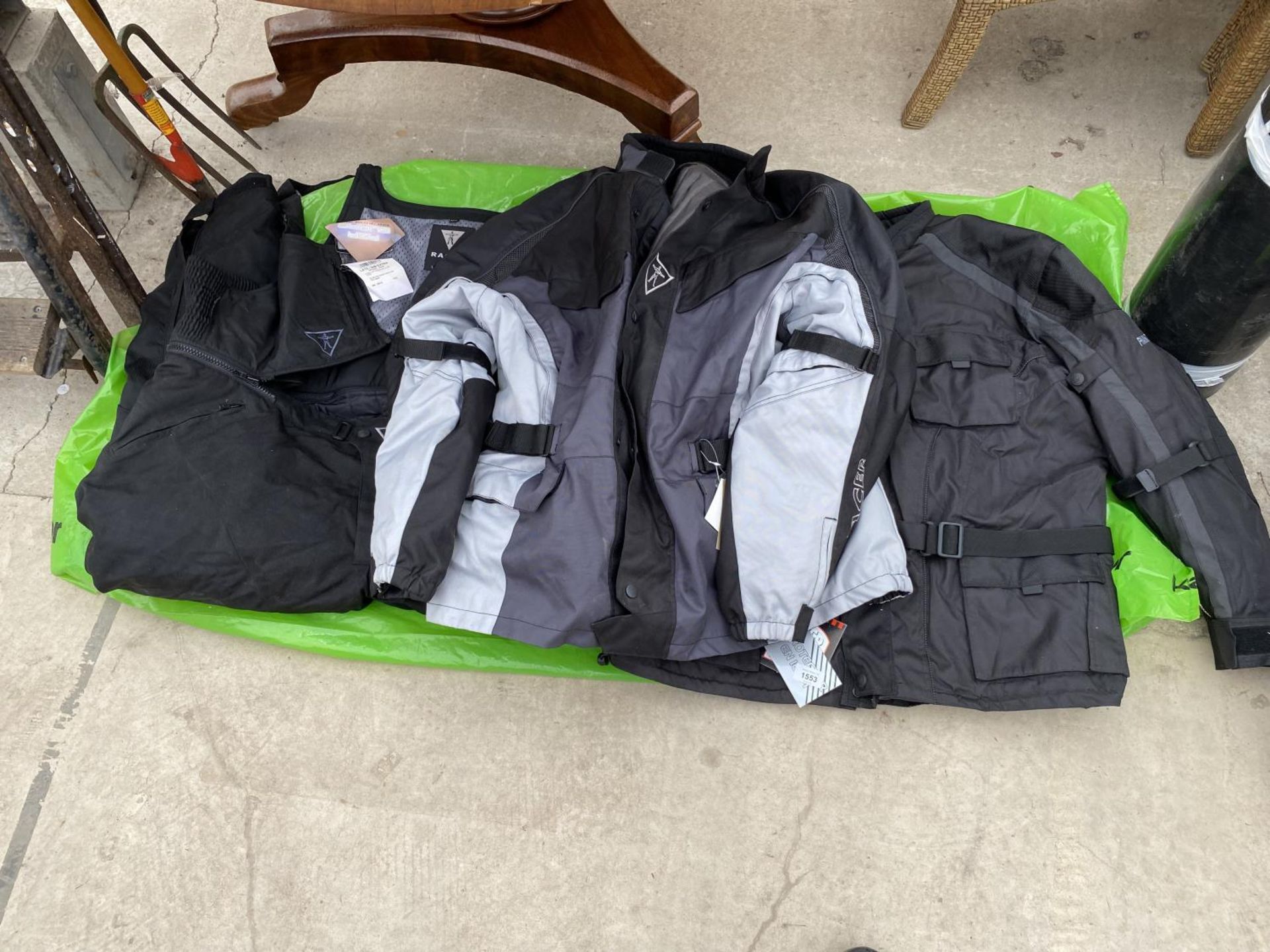 AN ASSORTMENT OF MOTORBIKE JACKETS AND TROUSERS