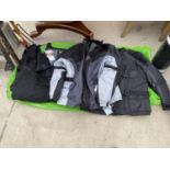 AN ASSORTMENT OF MOTORBIKE JACKETS AND TROUSERS