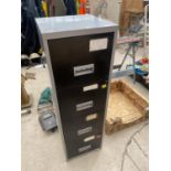 A FOUR DRAWER METAL FILING CABINET