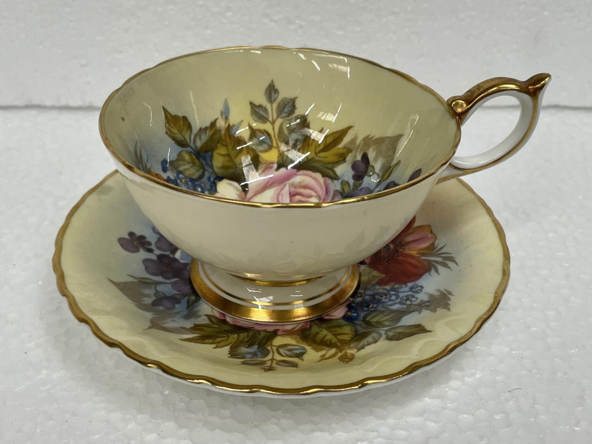 AN AYNSLEY J A BAILEY CABINET CUP AND SAUCER (HAIRLINE CRACK IN CUP)