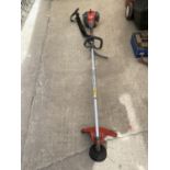 AN EFCO PETROL GRASS STRIMMER