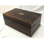 A MAHOGANY CASED WRITING SLOPE IN NEED OF RESTORATION
