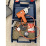 AN ELECTRIC DRILL WITH VARIOUS GRINDING STONES