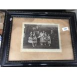 A FRAMED VINTAGE PHOTOGRAPH OF A WEDDING