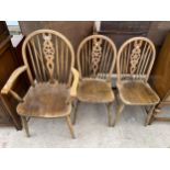 THREE MODERN WHEEL BACK DINING CHAIRS ONE BEING A CARVER
