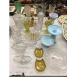 A LARGE QUANTITY OF GLASSWARE TO INCLUDE VASES, TOAST RACK, CANDLESTICKS, BOWLS, ETC