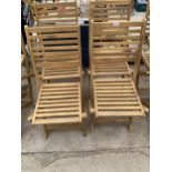 A SET OF FOUR BRAND NEW TEAK FOLDING GARDEN CHAIRS