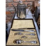 A BOXED VINTAGE SET OF KNIFE, FORK AND SPOONS PLUS A SILVER PLATED COFFEE POT WITH FLORAL AND SHIELD