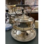 A SILVER PLATED SPIRIT KETTLE ON A TRAY