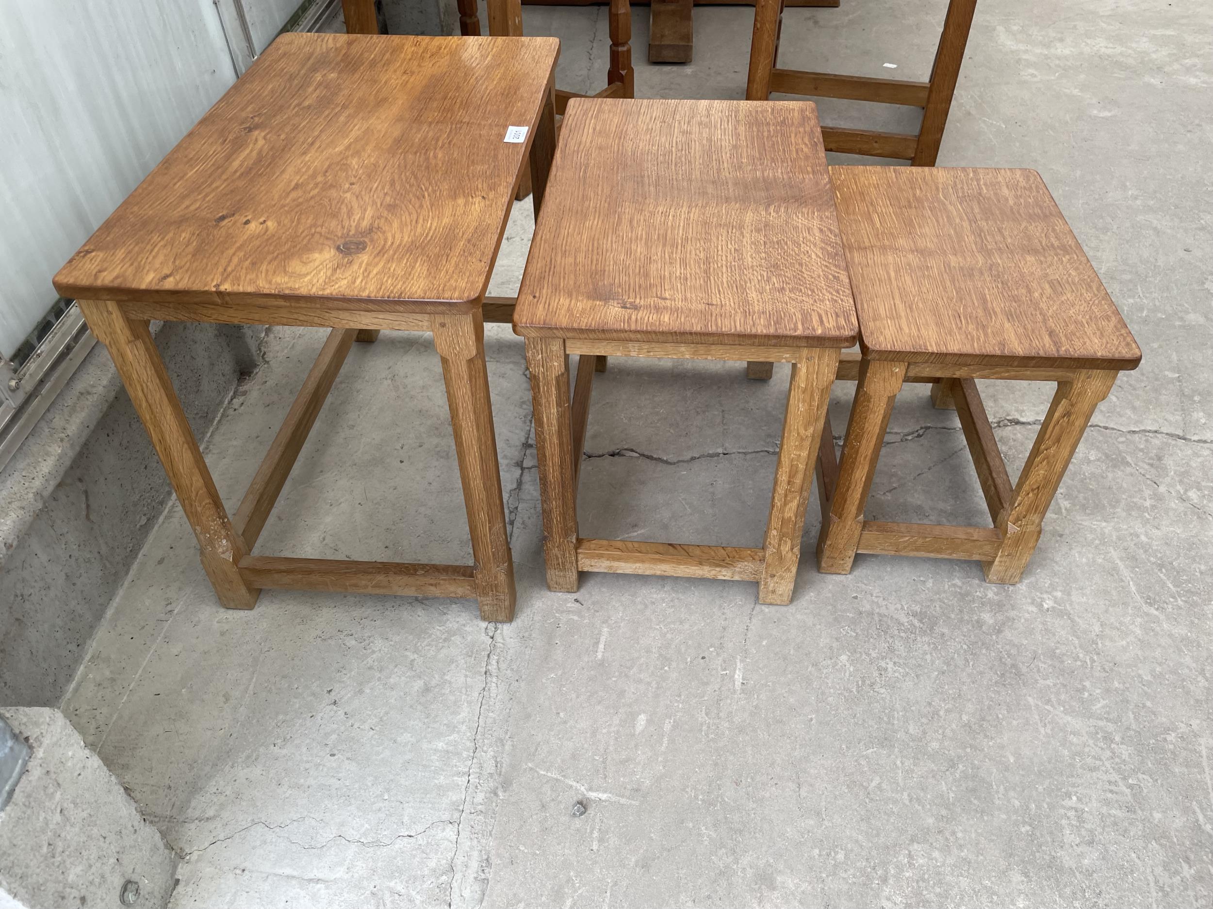 A MID 20TH CENTURY ROBERT 'MOUSEMAN' THOMPSON NEST OF THREE OAK TABLES ON OCTAGONAL LEGS, WITH ADZED - Image 7 of 7