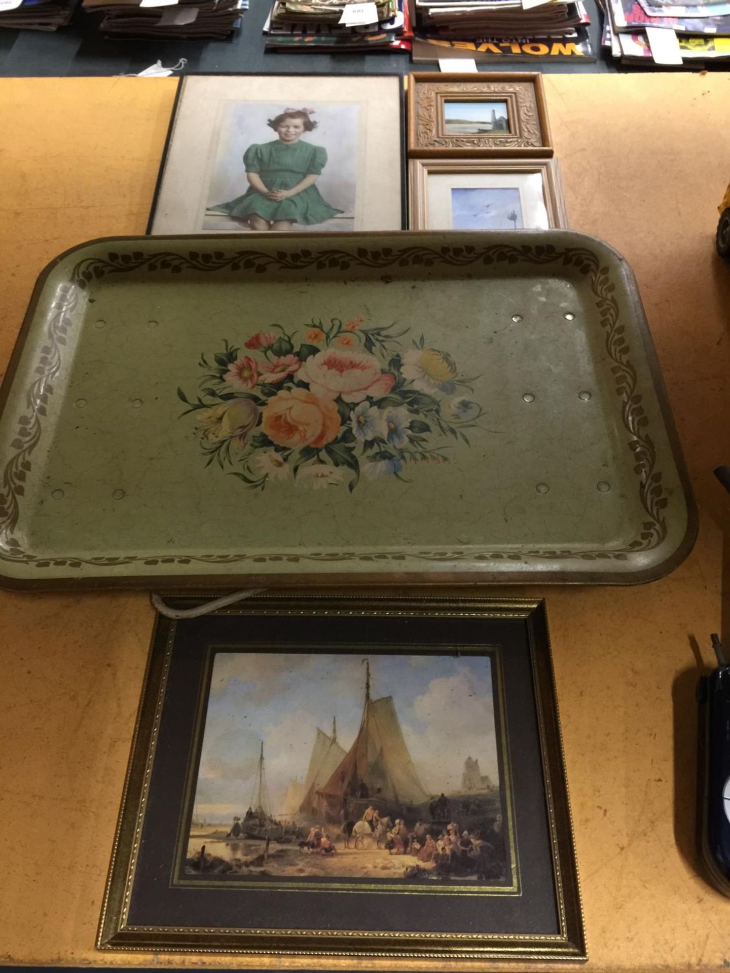 A VINTAGE TRAY WITH FOLD AWAY LEGS, THREE FRAMED PRINTS AND A FRAMED PHOGRAPH OF A GIRL