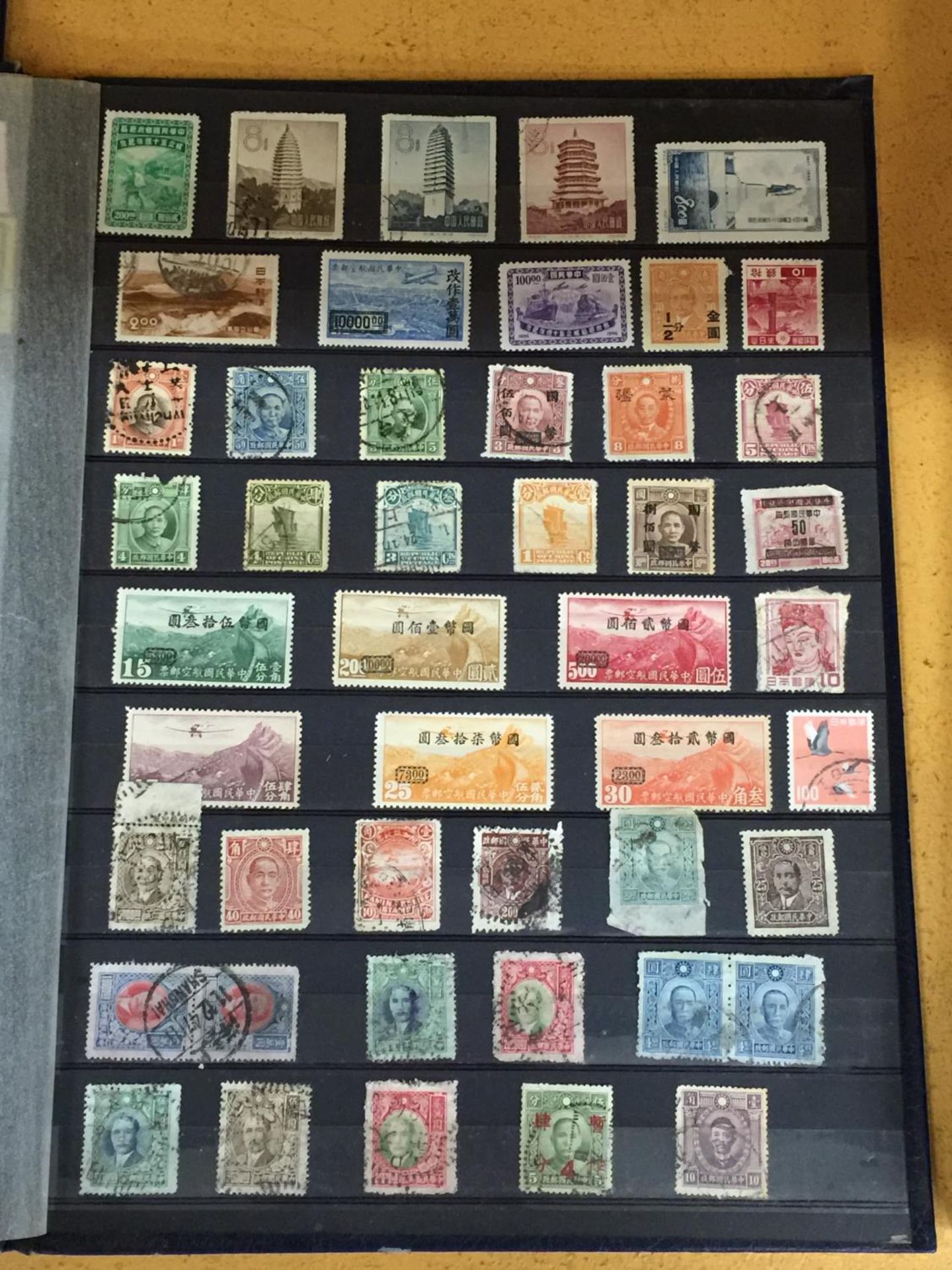 AN ALBUM CONTAINING RARE AND COLLECTABLE MOSTLY ASIAN STAMPS - Image 4 of 7