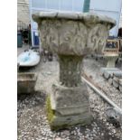 A LARGE RECONSTITUTED PLANTER WITH PEDESTAL BASE (A/F)