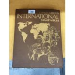 A STANLEY GIBBONS INTERNATIONAL STAMP ALBUM FROM ALGERIA TO ZIMBABWE