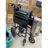 A FOLDING WHEEL CHAIR