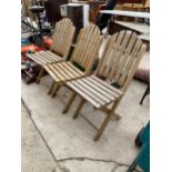 THREE FOLDING TEAK GARDEN CHAIRS