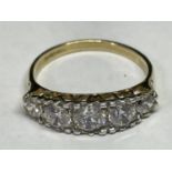A 9 CARAT GOLD RING WITH FIVE IN LINE CUBIC ZIRCONIAS SIZE N/O