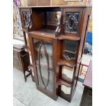 AN ART NOUVEAU MAHOGANY DISPLAY CABINET ENCLOSING CUPBOARDS AND BEVEL GLASS MIRRORS AND DOORS, 38"