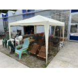 A FOLDING GAZEBO AND BOXES OF GAZEBO WEIGHTS