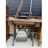 A SINGER TREADLE SEWING MACHINE