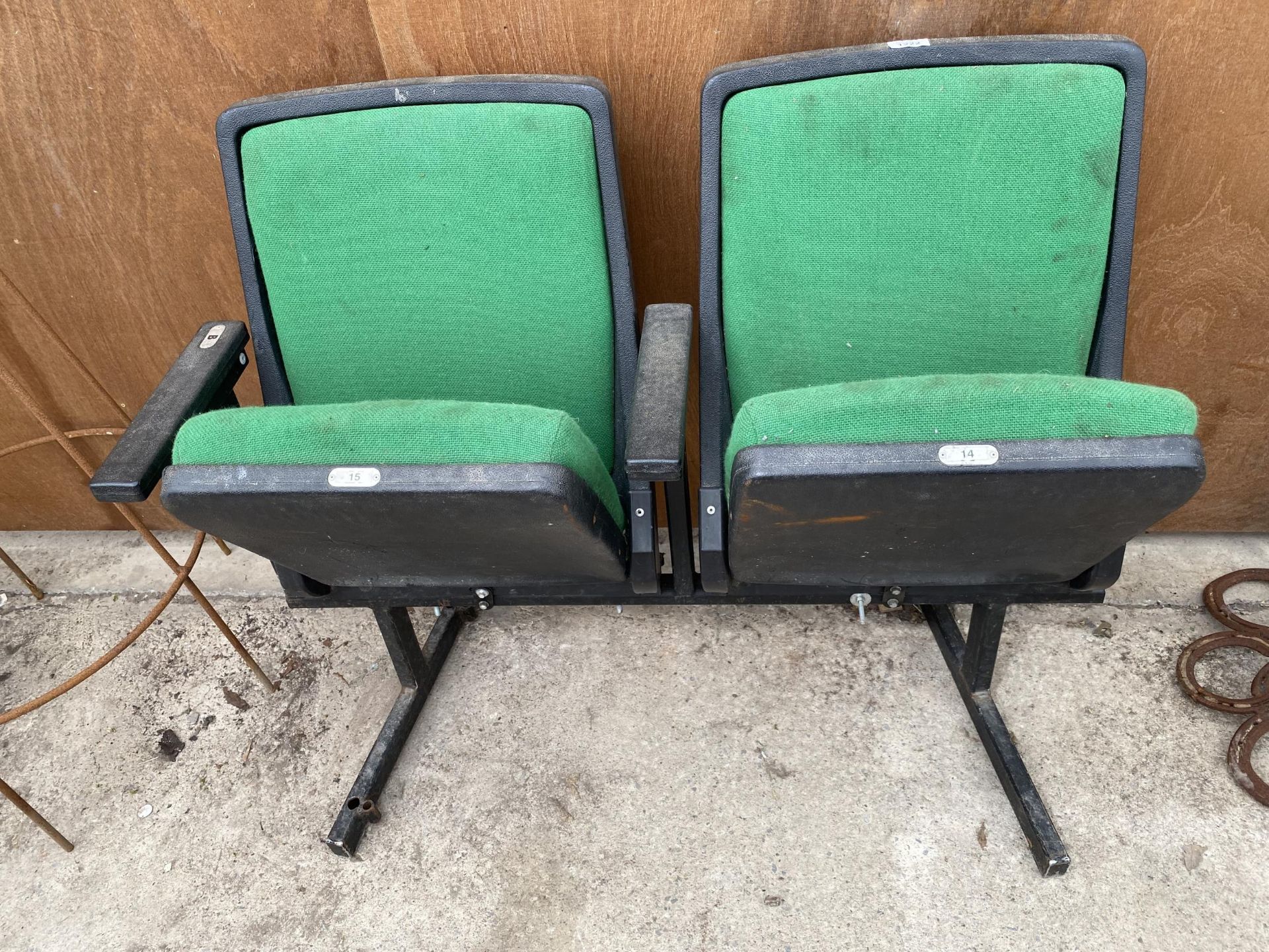 A PAIR OF RETRO CINEMA SEATS BEARING THE NUMBERS 14 & 15