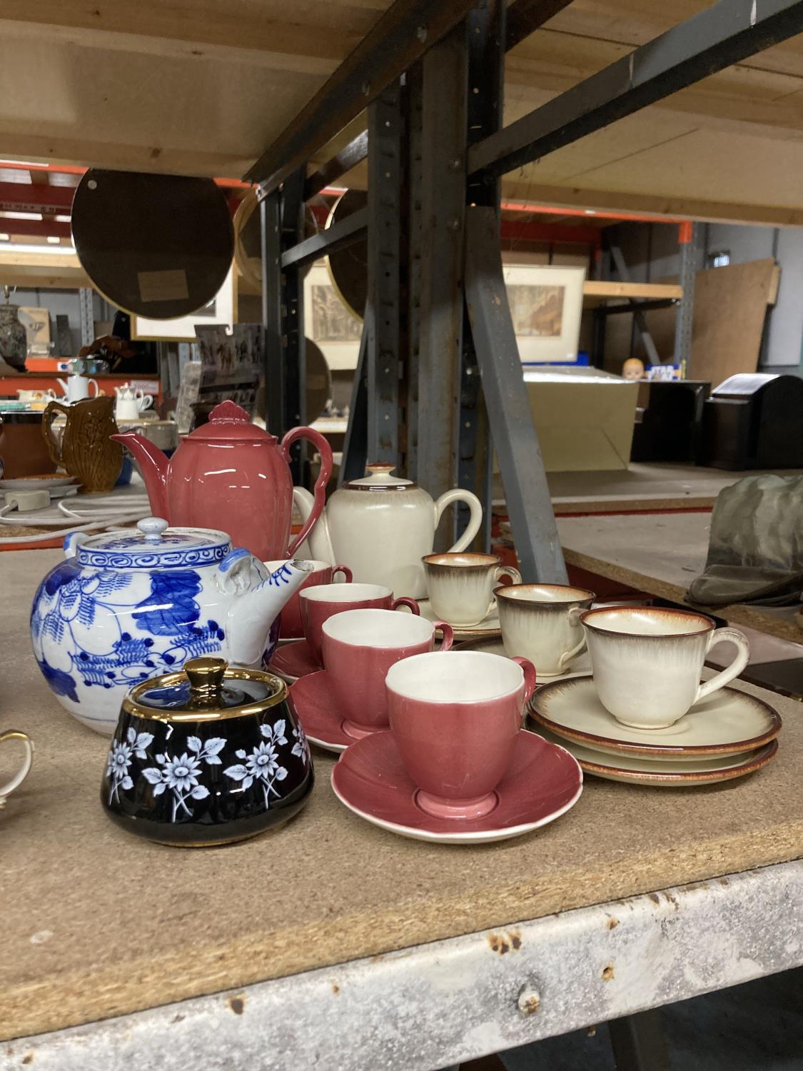 A CARLTONWARE COFFEE POT AND FOUR CUPS AND SAUCERS, WEST GERMAN TEAPOT WITH CUPS AND SAUCERS AND A