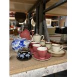 A CARLTONWARE COFFEE POT AND FOUR CUPS AND SAUCERS, WEST GERMAN TEAPOT WITH CUPS AND SAUCERS AND A