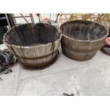 A PAIR OF OAK HALF BARREL PLANTERS