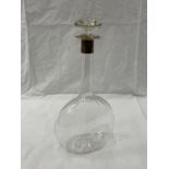 AN UNUSUAL GLASS DECANTER WITH A HALLMARKED LONDON SILVER COLLAR