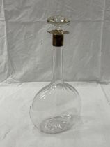 AN UNUSUAL GLASS DECANTER WITH A HALLMARKED LONDON SILVER COLLAR
