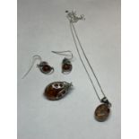 THREE ITEMS OF SILVER AND AMBER TO INCLUDE A LADYBIRD STYLE BROOCH, EARRINGS AND A PENDANT ON A