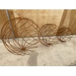 A SET OF THREE GRADUATED WROUGHT IRON SPHERICAL GARDEN FEATURES