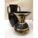 TWO BLACK DECORATED VASES ONE WITH HANDLES HEIGHT 30CM, THE OTHER WITH A WIDE RIM HEIGHT 22.5CM
