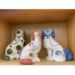 THREE CERAMIC STAFFORDSHIRE SPANIELS