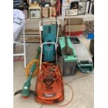 AN ASSORTMENT OF GARDEN ITEMS TO INCLUDE A BOSCH ROTAK LAWN MOWER, A SEEDER AND A KNEELER ETC