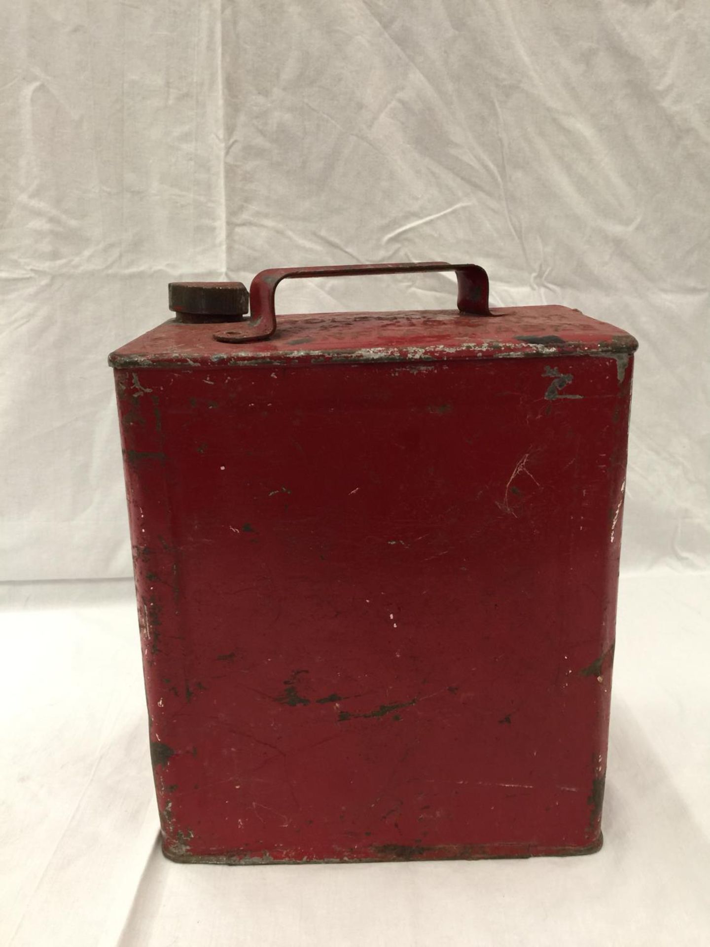 A VINTAGE RED PETROL CAN