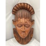 A LARGE CARVED TRIBAL MASK LENGTH 56CM