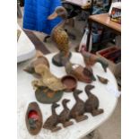 AN ASSORTMENT OF DUCK FIGURES TO INCLUDE TREEN AND CAST IRON ETC