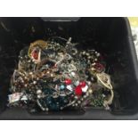 A BOX CONTAINING COSTUME JEWELLERY TO INCLUDE BEADS, BANGLES, BRACELETS, NECKLACES, ETC