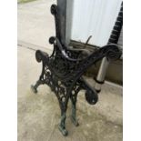 A PAIR OF DECORATIVE CAST IRON BENCH ENDS