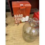 A HARD CIDER KIT AND A GLASS DEMI JOHN