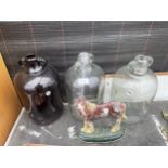 THREE GLASS DEMI JOHNS AND A CAST HORSE DOOR STOP