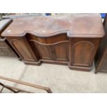 A VICTORIAN BREAKFRONT SERPENTINE SIDEBOARD ENCLOSING FOUR PANELLED CUPBOARDS AND SINGLE DRAWER, 56"