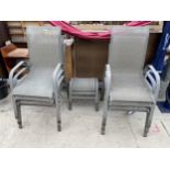 SIX METAL FRAMED STACKING CHAIRS AND TWO FOOT STOOLS