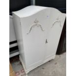 A WHITE PAINTED TWO DOOR WARDROBE