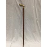 A WOODING WALKING CANE WITH A BRASS JAGUAR HANDLE