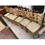 A SET OF SIX MODERN LADDERBACK RUSH SEATED DINING CHAIRS