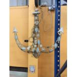A WALL HANGING METAL ANCHOR DECORATED WITH METAL SHELLS HEIGHT APPROX 90CM, WIDTH APPROX 90CM