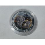 A 1OZ 999 SILVER 2014 AFRICAN SOMALI REPUBLIC 100 SHILLINGS COIN WITH AFRICAN ELEPHANT DECORATION